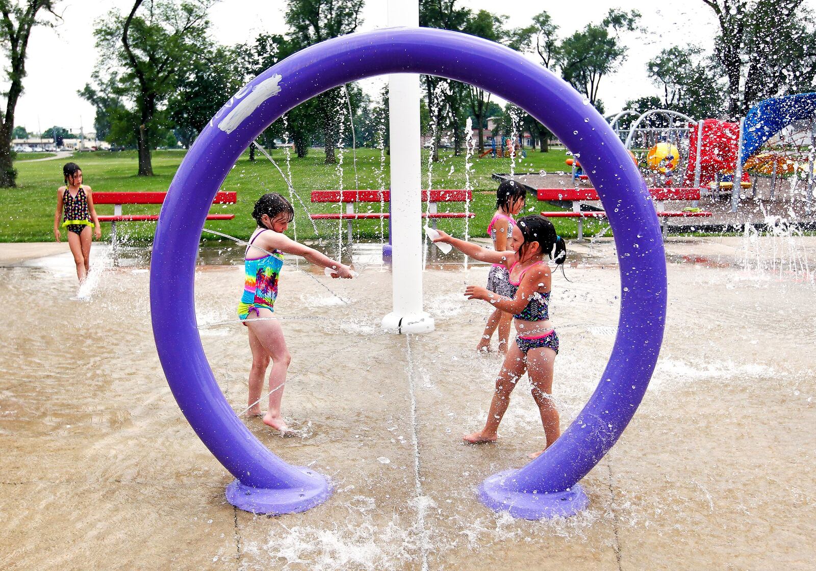 Children splash at the Douglass Park Splash Pad in Middletown. STAFF FILE PHOTO