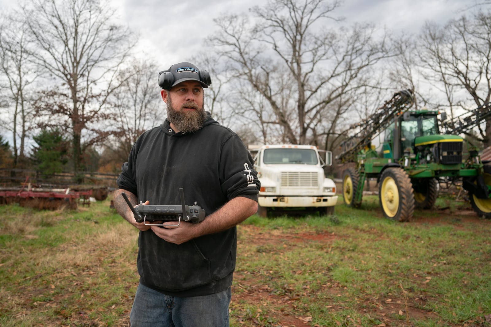 Russell Hedrick uses a DJI drone to put crop cover on his farm, Tuesday, Dec. 17, 2024, in Hickory, N.C. (AP Photo/Allison Joyce)