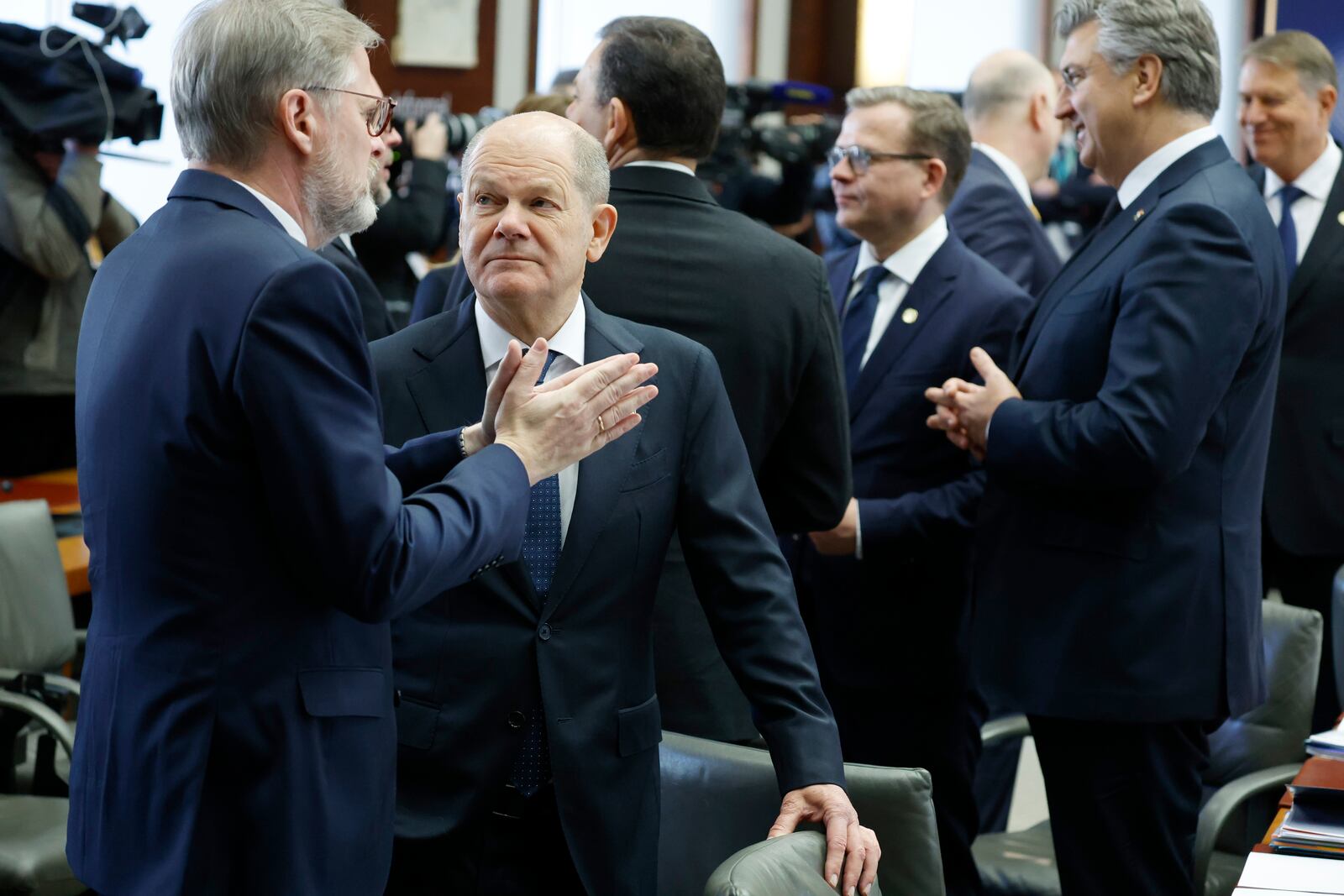 Germany's Chancellor Olaf Scholz, second left, speaks with Czech Republic's Prime Minister Petr Fiala, left, at a round table meeting during an EU summit in Brussels, Monday, Feb. 3, 2025. (AP Photo/Geert Vanden Wijngaert)