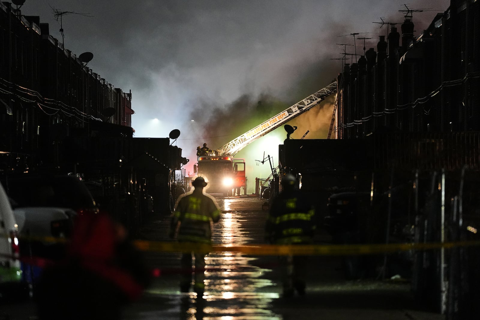 First responders work the scene after a small plane crashed in Philadelphia, Friday, Jan. 31, 2025. (AP Photo/Matt Rourke)