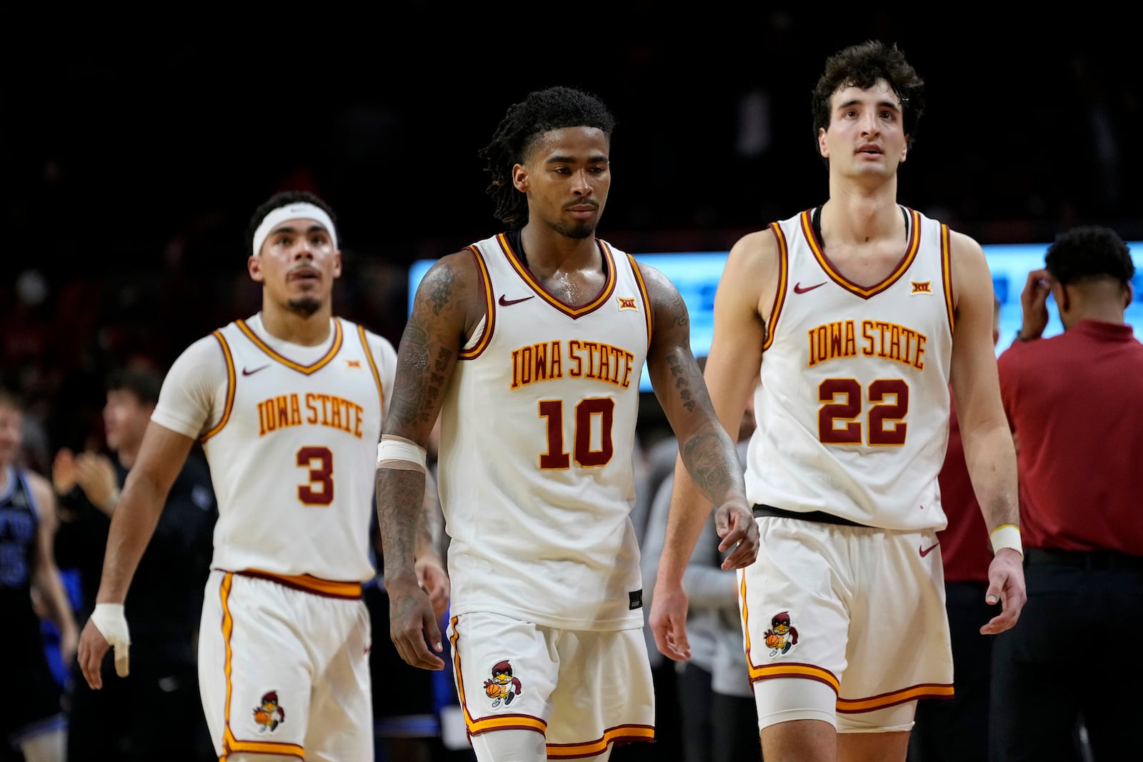 Iowa State guard Keshon Gilbert (10) walks off the court with teammates guard Tamin Lipsey (3) and forward Milan Momcilovic (22) after an NCAA college basketball game Tuesday, March 4, 2025, in Ames, Iowa. (AP Photo/Charlie Neibergall)