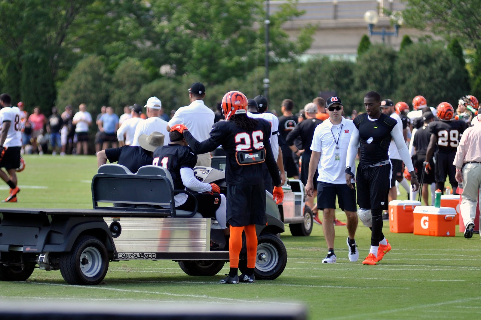 Bengals defensive back Josh Shaw (26) gives Derron Smith a supportive pat on the head after the safety went down with an injury in Sunday’s practice. JAY MORRISON/STAFF