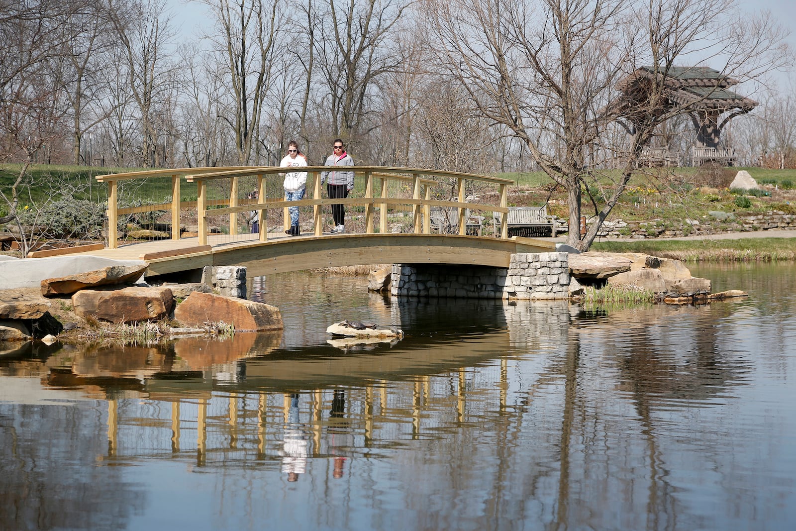 A stroll through Cox Arboretum MetroPark has become more accessible. The scenic "Monet Bridge" has been upgraded and is now ADA accessible. A new brick paved path also loops through the park making it easier for strollers and wheelchairs to navigate. LISA POWELL / STAFF