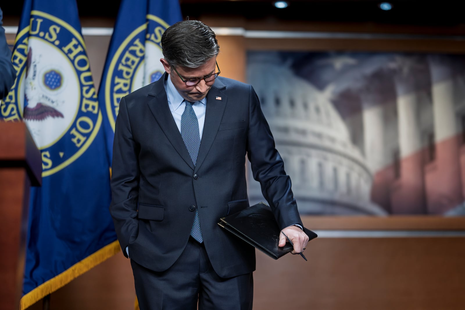 Speaker of the House Mike Johnson, R-La., pauses before talking to reporters about work on a final version of a spending bill before federal agencies run out of money at midnight on Friday night, at the Capitol in Washington, Tuesday, Dec. 17, 2024. (AP Photo/J. Scott Applewhite)