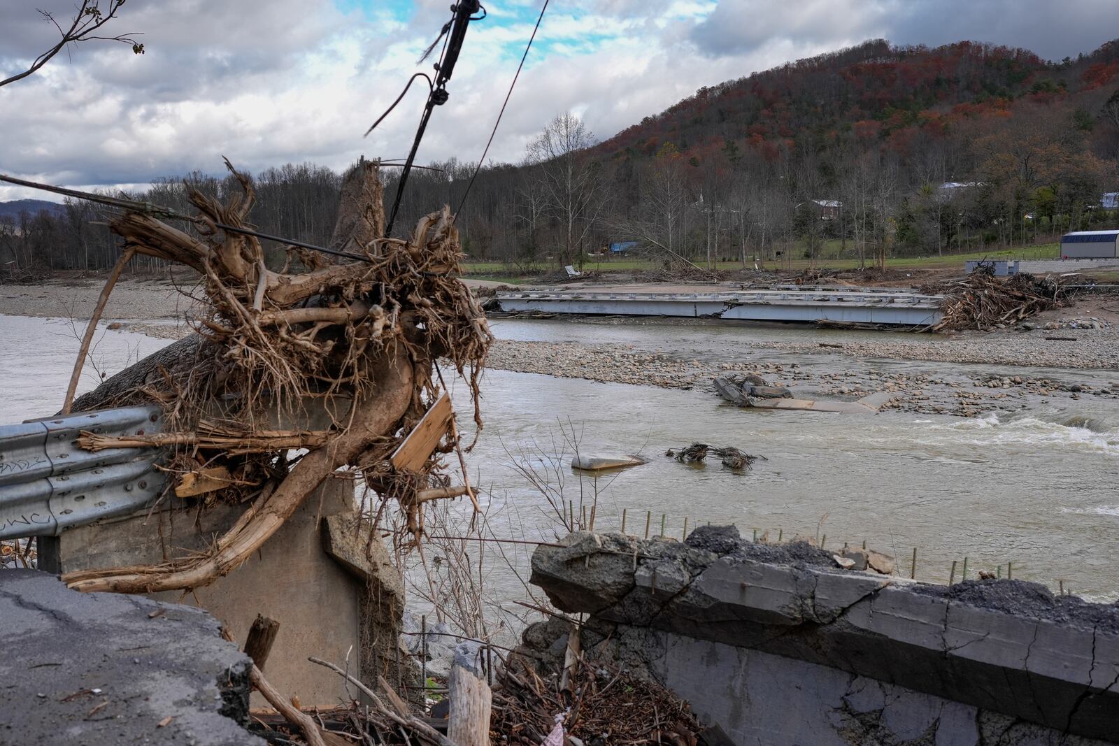 Flood debris from Hurricane Helene is seen on the banks of the Nolichucky River, Friday, Nov. 22, 2024, in Erwin, Tenn. (AP Photo/George Walker IV)