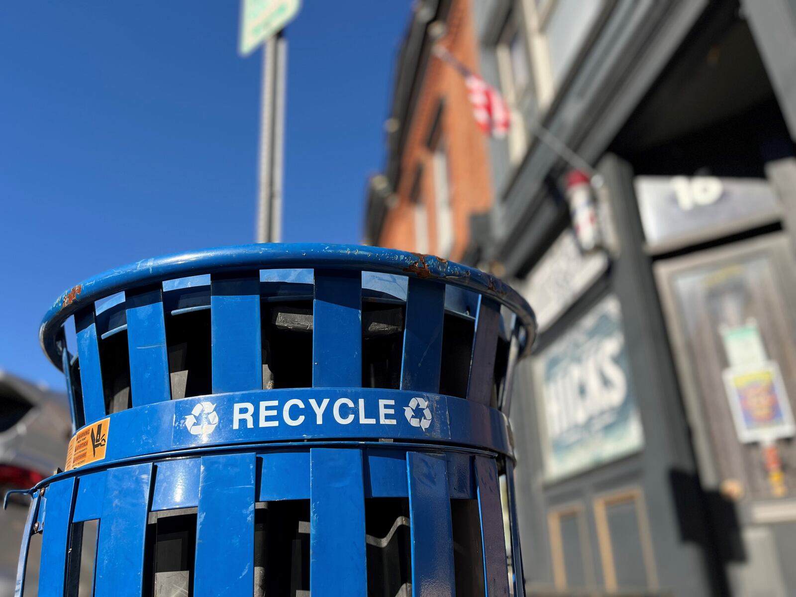 A recycling container in the Oregon District in Dayton. CORNELIUS FROLIK / STAFF