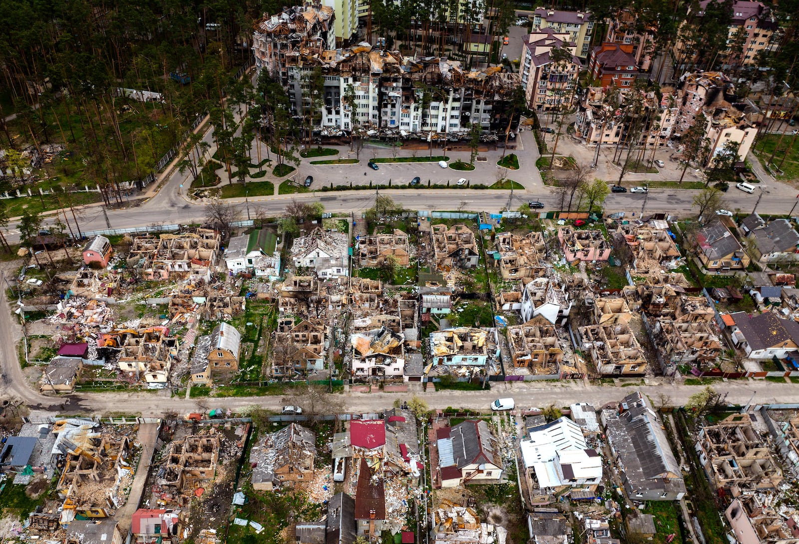 FILE - Destroyed houses are photographed in Irpin, on the outskirts of Kyiv, Ukraine, Saturday, April 30, 2022. (AP Photo/Emilio Morenatti, File)