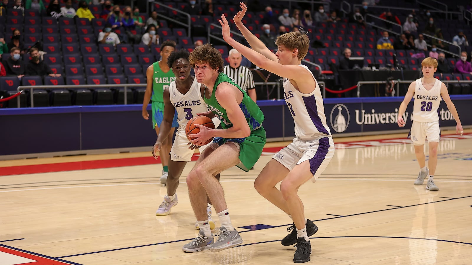 50: Chaminade Julienne High School senior Daniel Nauseef drives past Columbus St. Francis DeSales junior Atticus Schuler during their Division II state semifinal game on Saturday afternoon at UD Arena. DeSales won 51-34. Michael Cooper/CONTRIBUTED