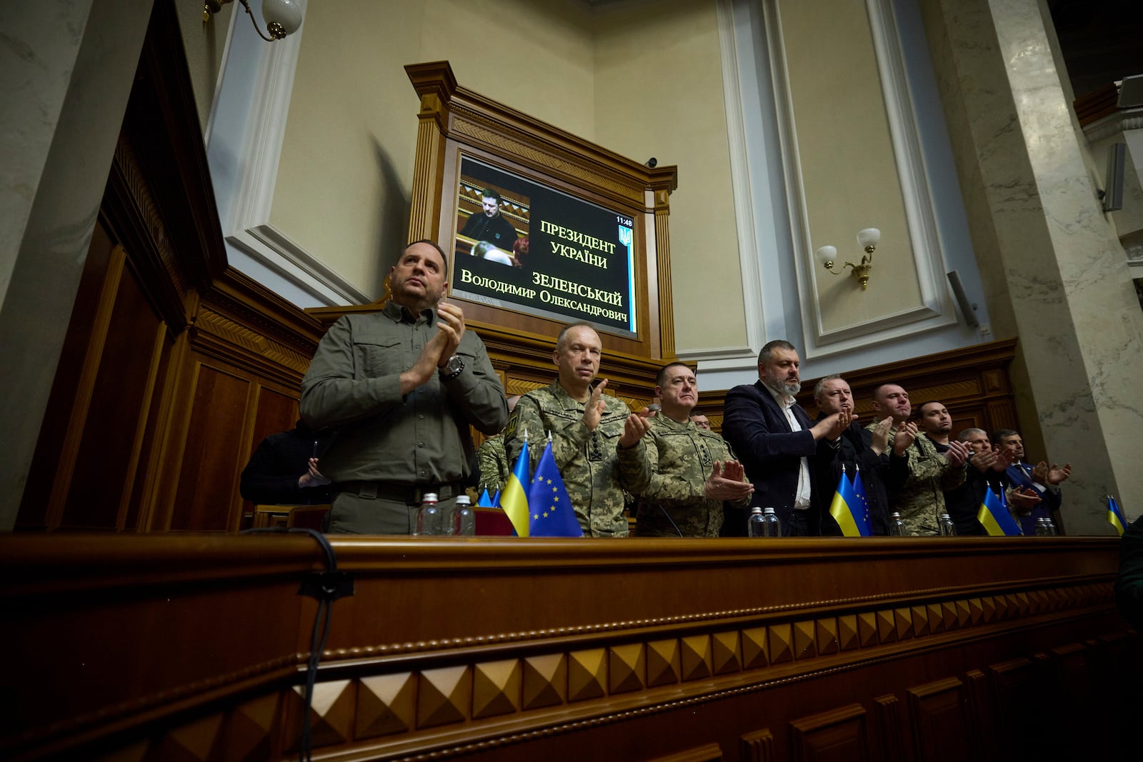 In this photo provided by the Press Service Of The President Of Ukraine on Oct. 16, 2024, Head of Ukrainian Presidential Office Andriy Yermak,left, Commander-in-Chief of the Armed Forces of Ukraine General Oleksandr Syrskyi, Lieutenant Generel Bargilevich Anatoly Chief of the General Staff of the Armed Forces of Ukraine, Oleksandr Lytvynenko Head of Foreign Intelligence Service of Ukraine, Maj. Gen. Vasyl Maliuk Chief of Ukraine's Security Service, Maj. Gen. Kyrylo Budanov, Ukraine's military intelligence chief, listen a speech of Ukraine's President Volodymyr Zelenskyy at Verkhovna Rada in Kyiv, Ukraine. (Press Service Of The President Of Ukraine via AP)