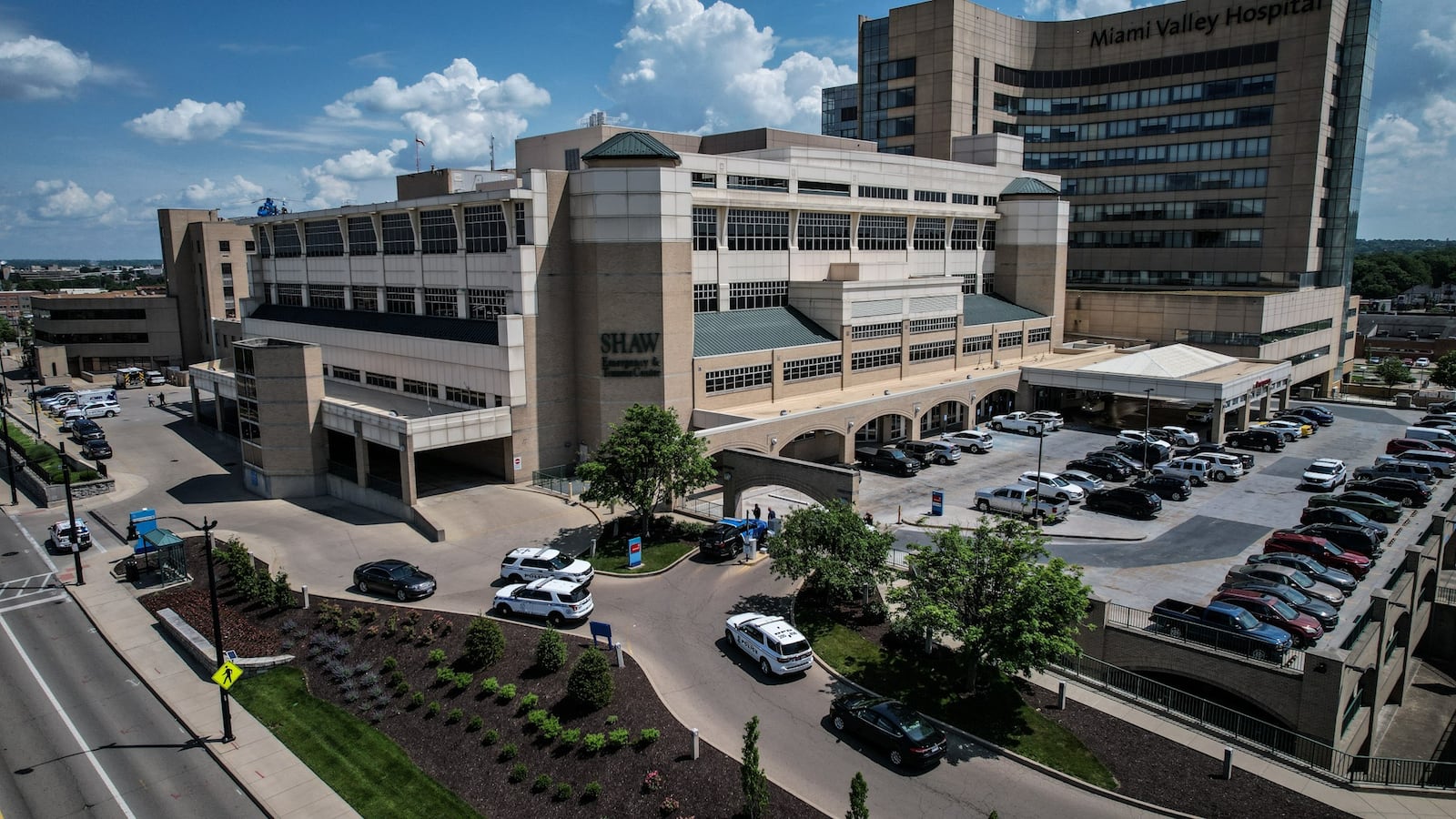 Police officers were outside Miami Valley Hospital Wednesday June 1, 2022, after a Montgomery County Jail inmate and a private security guard died in a shooting. JIM NOELKER/STAFF