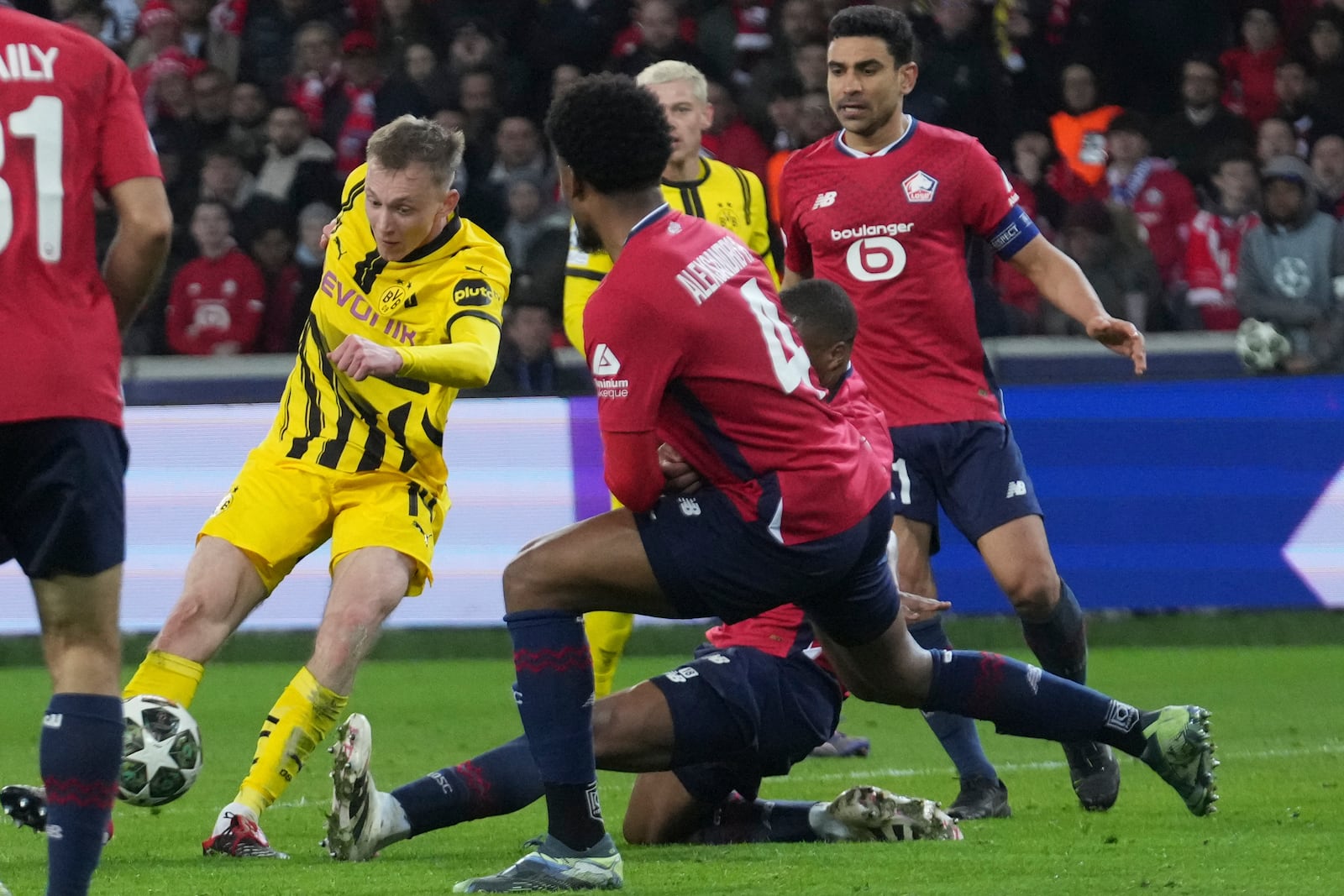 Dortmund's Maximilian Beier scores during the Champions League round of 16 second leg soccer match between Lille and Borussia Dortmund in Villeneuve-d'Ascq , Wednesday, March 12, 2025. (AP Photo/Michel Euler)