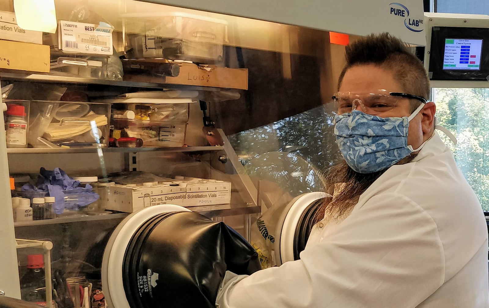 UDRI researcher Luis Estevez, at work at a glove box. Contributed.