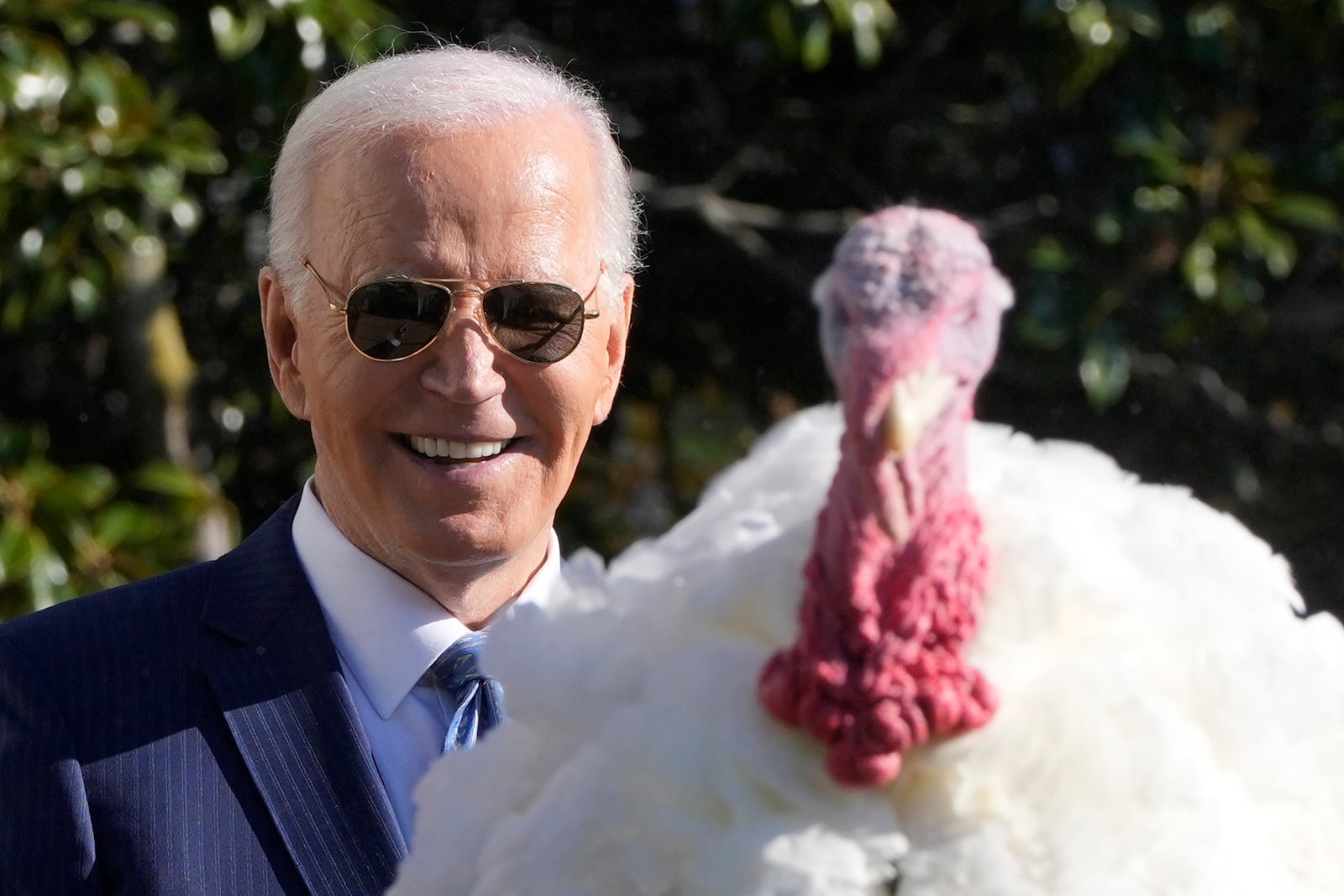 President Joe Biden speaks after pardoning the national Thanksgiving turkey, Peach, during a ceremony on the South Lawn of the White House in Washington, Monday, Nov. 25, 2024. (AP Photo/Mark Schiefelbein)