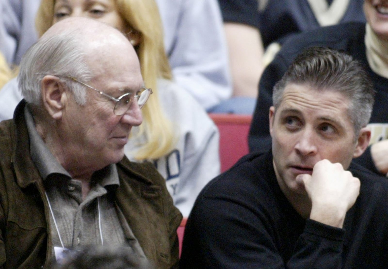 15 Mar 05 Photo by Ron Alvey. Bucky Bockhorn (left), voice of the Flyers, and Dayton head coach, Brian Gregory, watch the opening round of the NCAA basketball tournament.