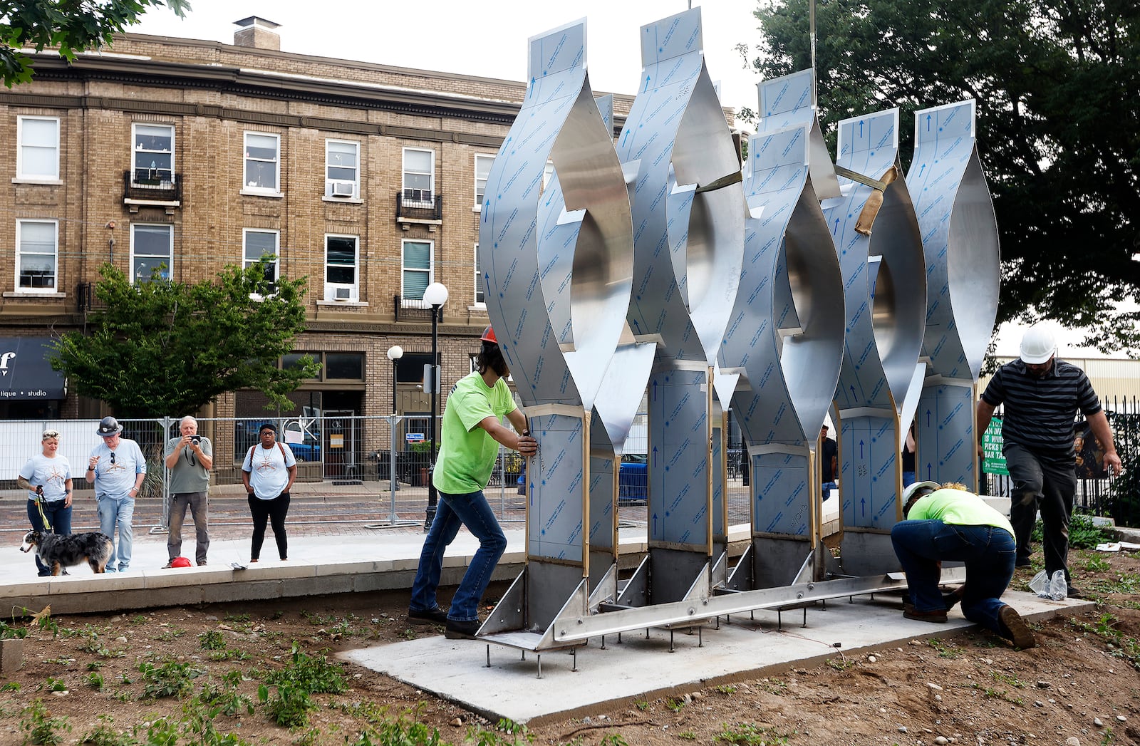 The Seed of Life sculpture for the Oregon District shooting memorial was craned in Thursday, July 25, 2024. MARSHALL GORBY\STAFF