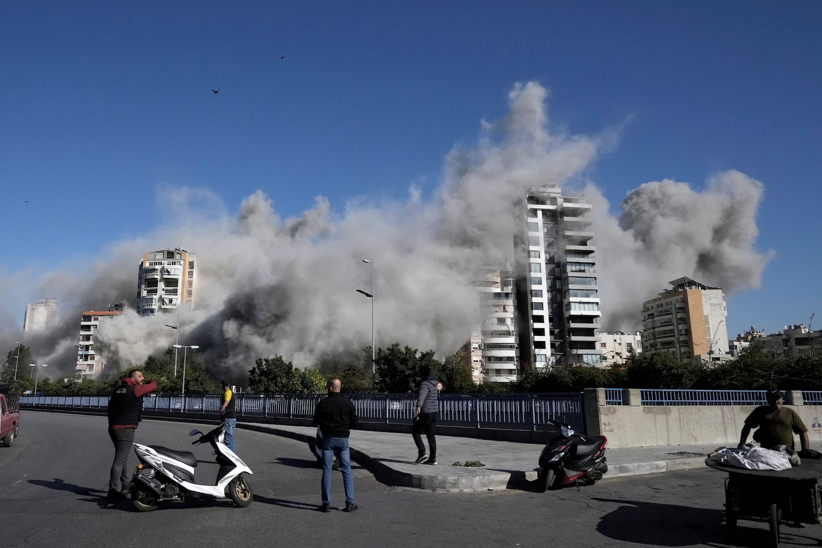 Smoke rises from a building that was hit by an Israeli airstrike in Ghobeiri, Beirut, Lebanon, Tuesday, Oct. 22, 2024. (AP Photo/Bilal Hussein)