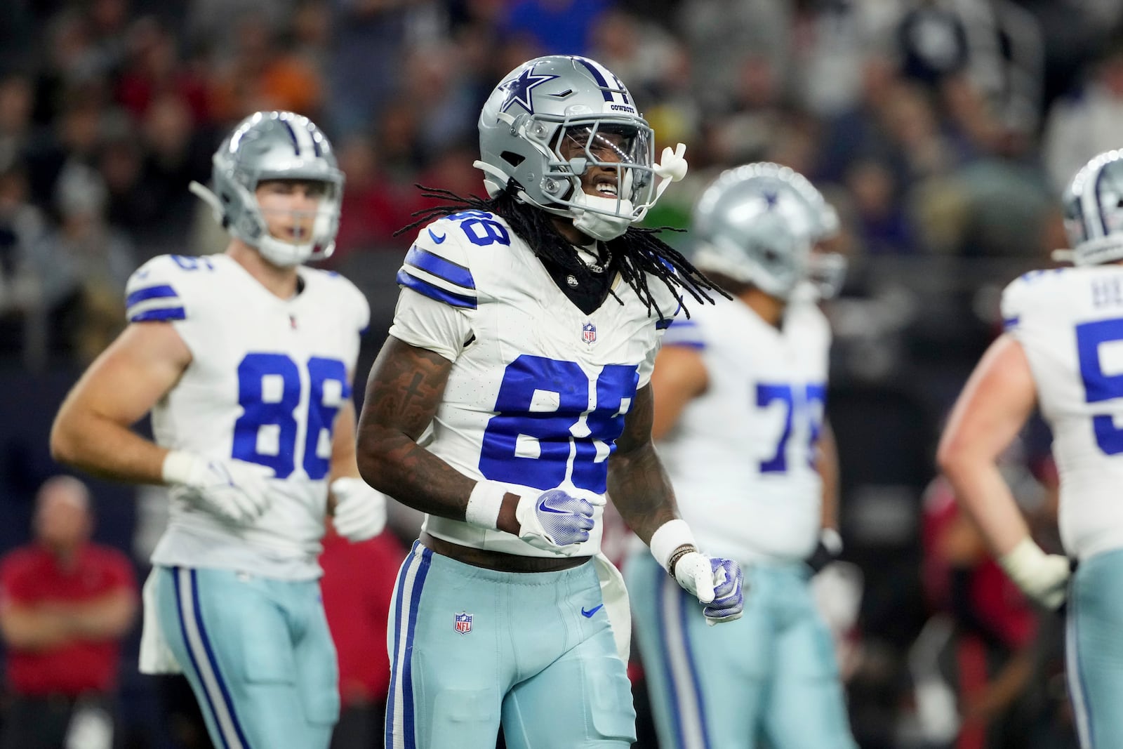 Dallas Cowboys wide receiver CeeDee Lamb (88) jogs to the sideline after making a catch inthe first half of an NFL football game against the Tampa Bay Buccaneers in Arlington, Texas, Sunday, Dec. 22, 2024. (AP Photo/Jeffrey McWhorter)