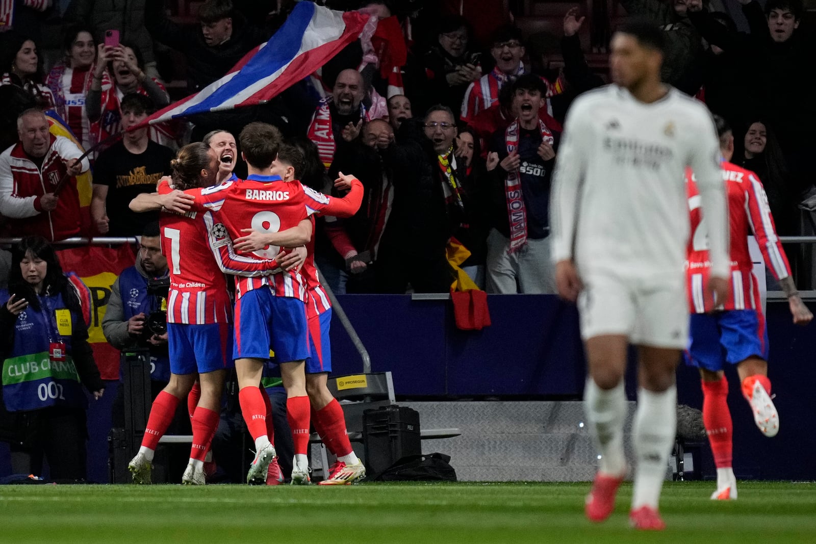 Atletico Madrid players celebrate after a goal during the Champions League round of 16, second leg, soccer match between Atletico Madrid and Real Madrid at the Metropolitano stadium in Madrid, Spain, Wednesday, March 12, 2025. (AP Photo/Bernat Armangue)