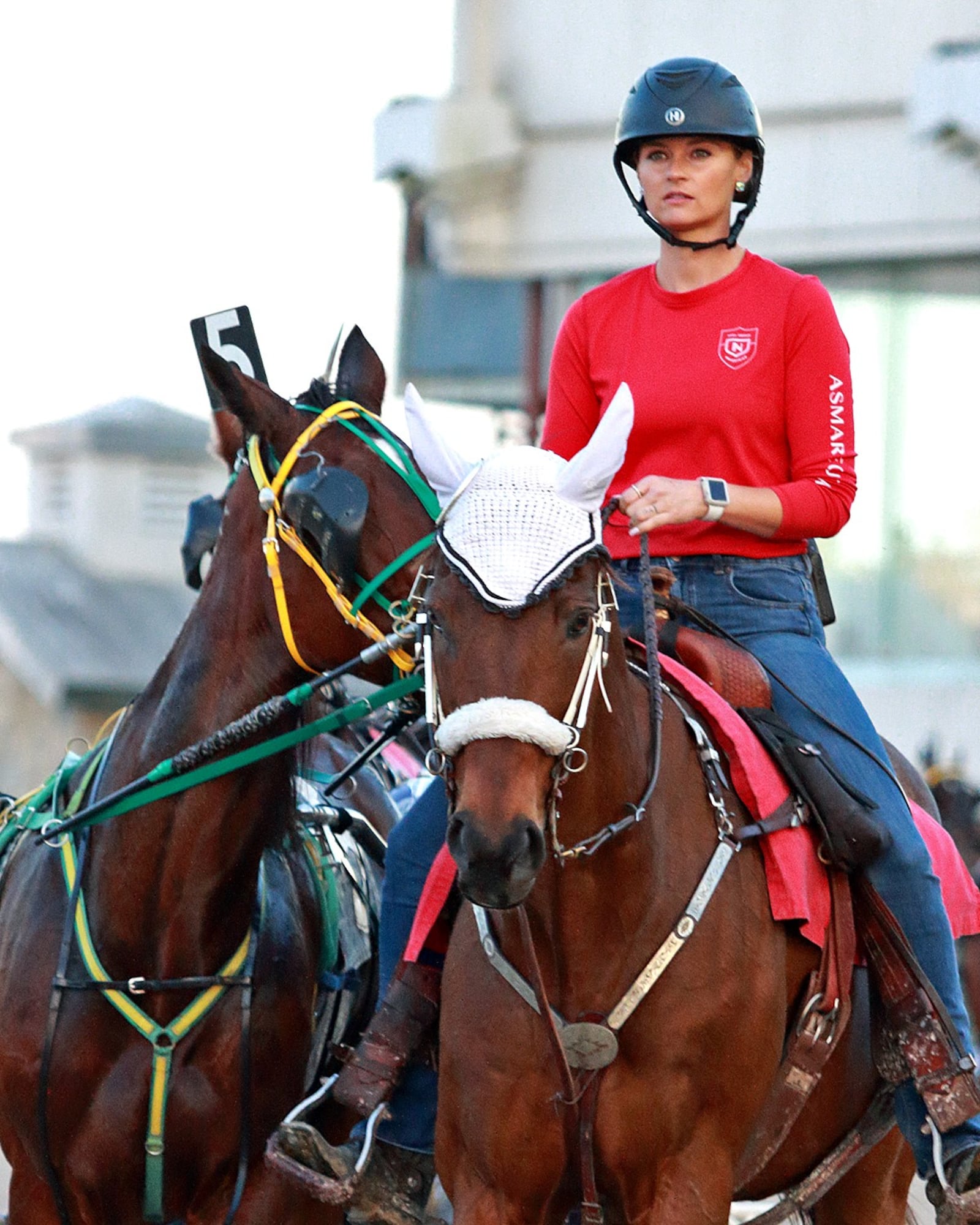 Ashley Holliday, the outrider at Miami Valley Raceway in Lebanon – as well as Dayton Raceway and Scioto Downs, when they are in session – is a guardian angel in spurs at Ohio harness tracks and puts the safety of drivers and their Standardbred horses first, sometimes to her own peril. Photo courtesy of Conrad Photo