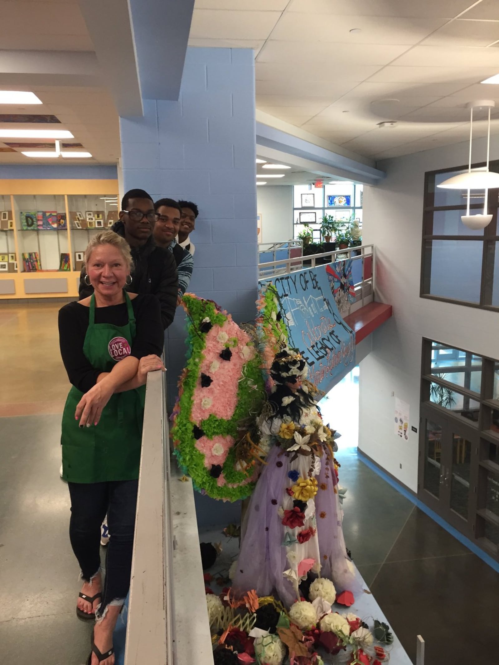 Belmont High School art teacher Carol Rogers stands with her students next to the new “angel” created from Mendelson’s items. CONTRIBUTED