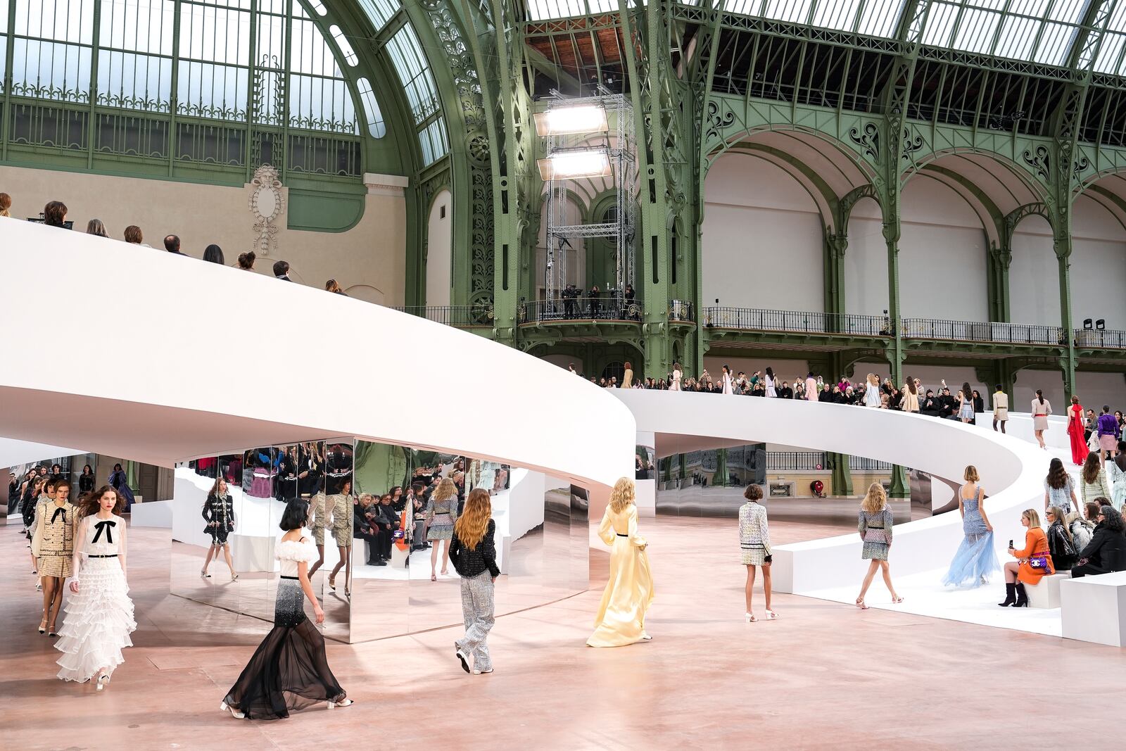 Models wear creations as part of the Chanel Haute Couture Spring Summer 2025 collection, that was presented in Paris, Tuesday, Jan. 28, 2025. (AP Photo/Lewis Joly).