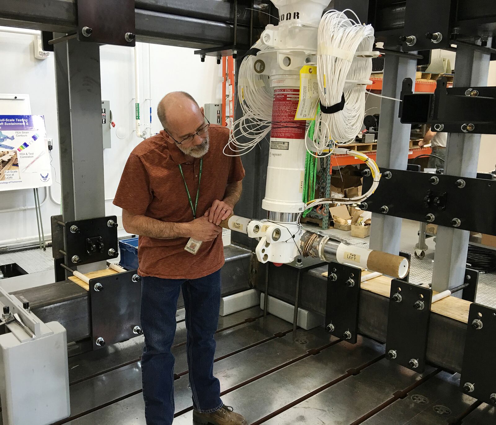 A UDRI researcher inspects the landing gear of a C-130 cargo plane during work for a commercial sponsor in 2016. UDRI  photo