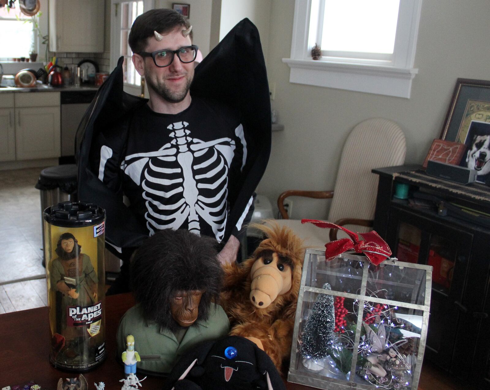 Josher Lumpkin, the organizer of Geek Gala 2018  at Blind Bob's, shows off some of his geeky treasures.  He dressed as a demonic bat skeleton person  to show that all sorts of fandom will be accepted at the event.