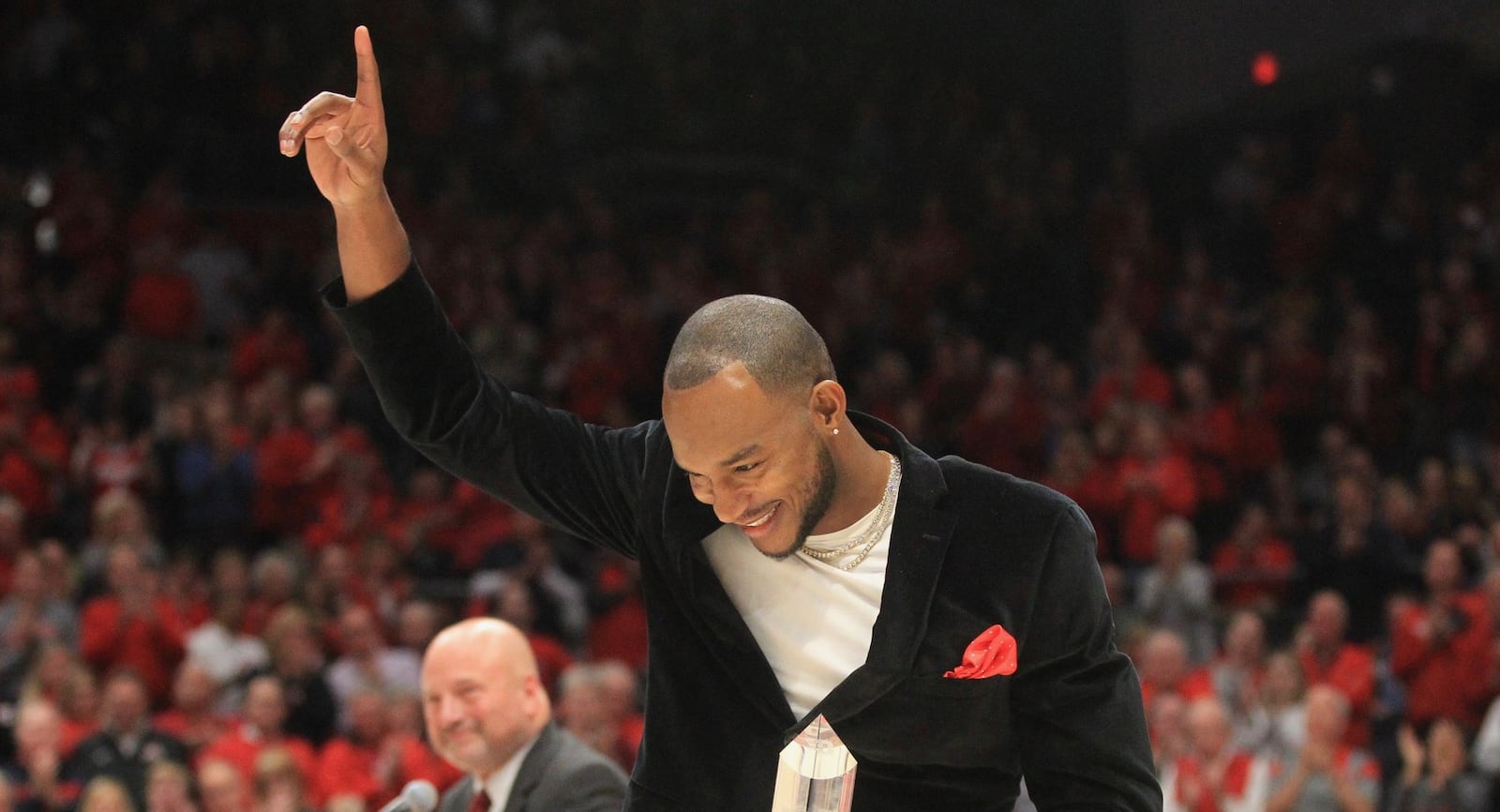 Chris Wright is honored during the Dayton Flyers Hall of Fame induction ceremony during halftime of a game against Massachusetts on Saturday, Jan. 11, 2020, at UD Arena. David Jablonski/Staff