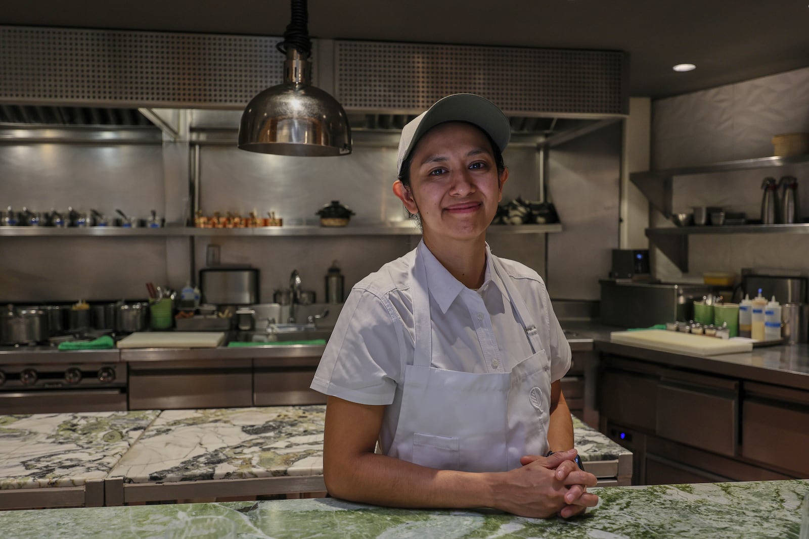 Geraldine Rodriguez, sous-chef of the Quintonil restaurant, poses for a portrait in the kitchen in Mexico City, Friday, Feb. 28, 2025. (AP Photo/Ginnette Riquelme)