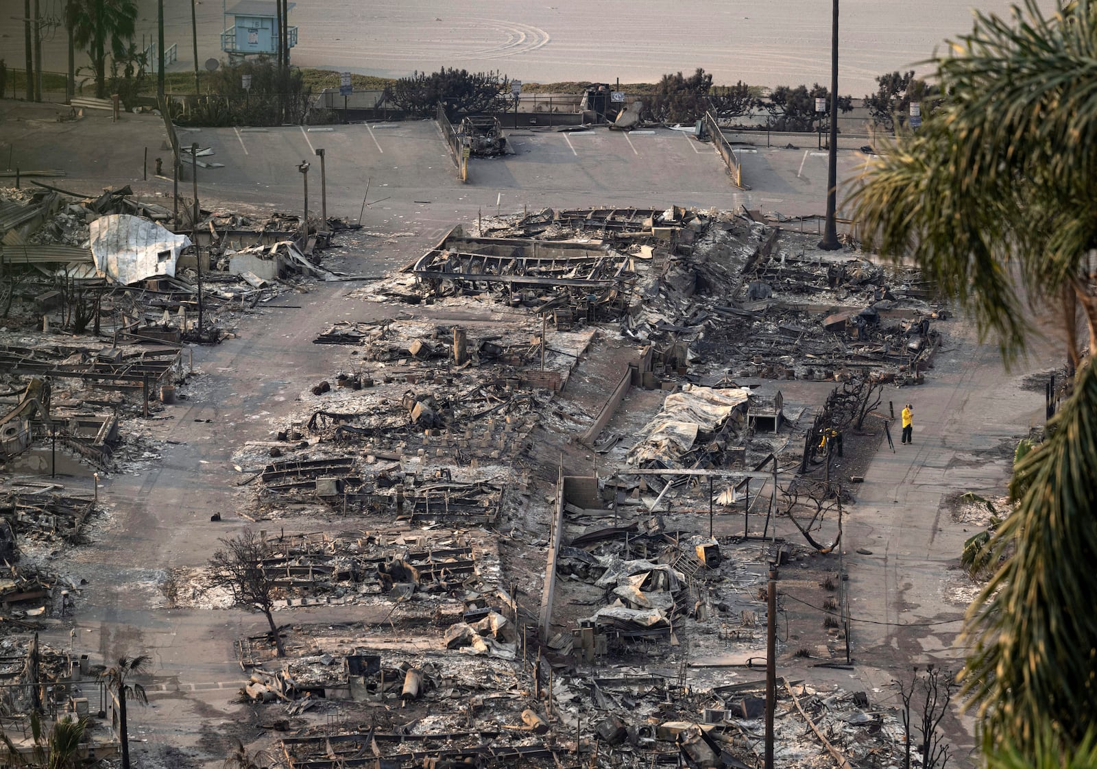 Homes destroyed by the Palisades Fire are seen Saturday, Jan. 11, 2025, in the Pacific Palisades neighborhood of Los Angeles. (Mindy Schauer/The Orange County Register via AP)