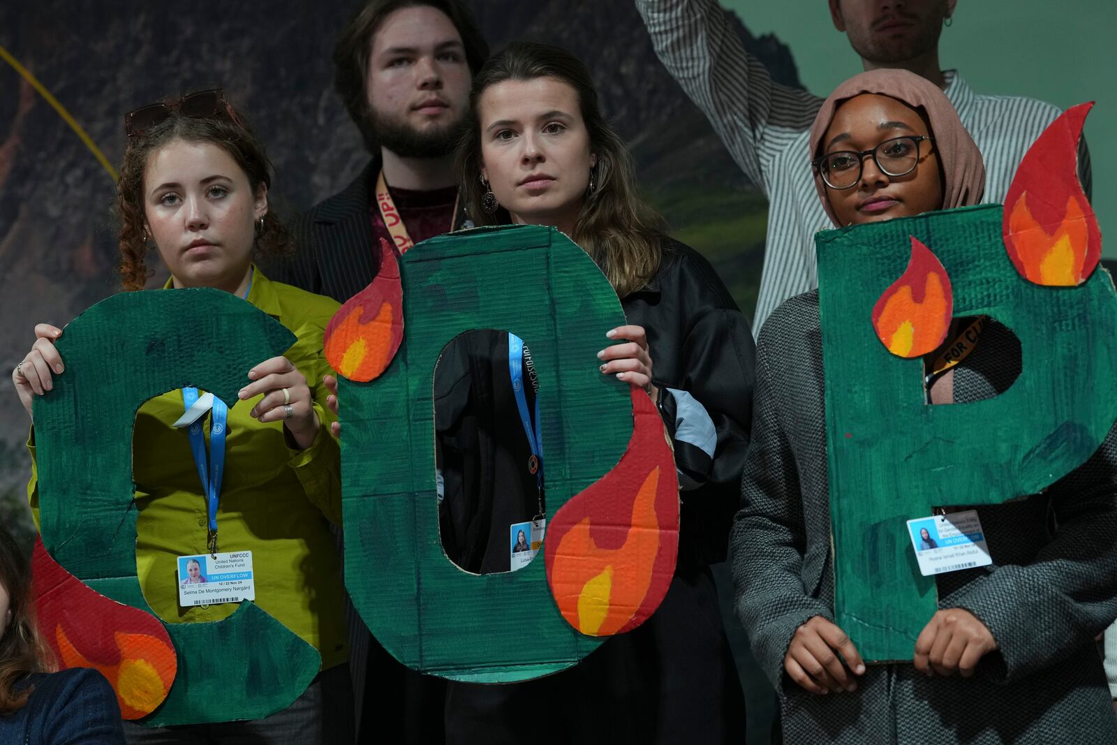 Activist Luisa Neubauer, of Germany, center, participates in a demonstration against fossil fuels at the COP29 U.N. Climate Summit, Friday, Nov. 15, 2024, in Baku, Azerbaijan. (AP Photo/Peter Dejong)