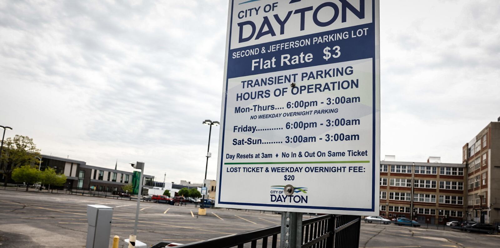 A city of Dayton-owned parking lot on the south side of East Second Street sits empty, taking up most of the land between St. Clair Street and Jefferson Street. JIM NOELKER / STAFF