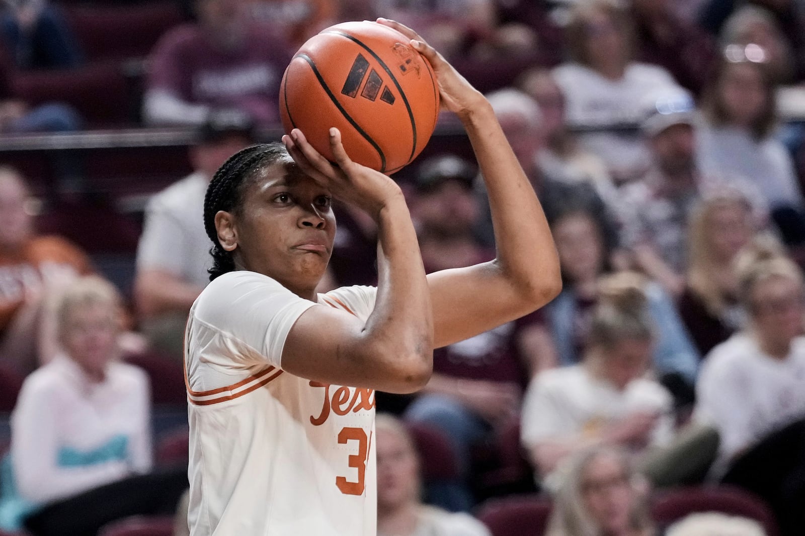 FILE - Texas forward Madison Booker (35) shoots a three point basket against Texas A&M during the third quarter of an NCAA college basketball game Sunday, Feb. 2, 2025, in College Station, Texas. (AP Photo/Sam Craft, File)