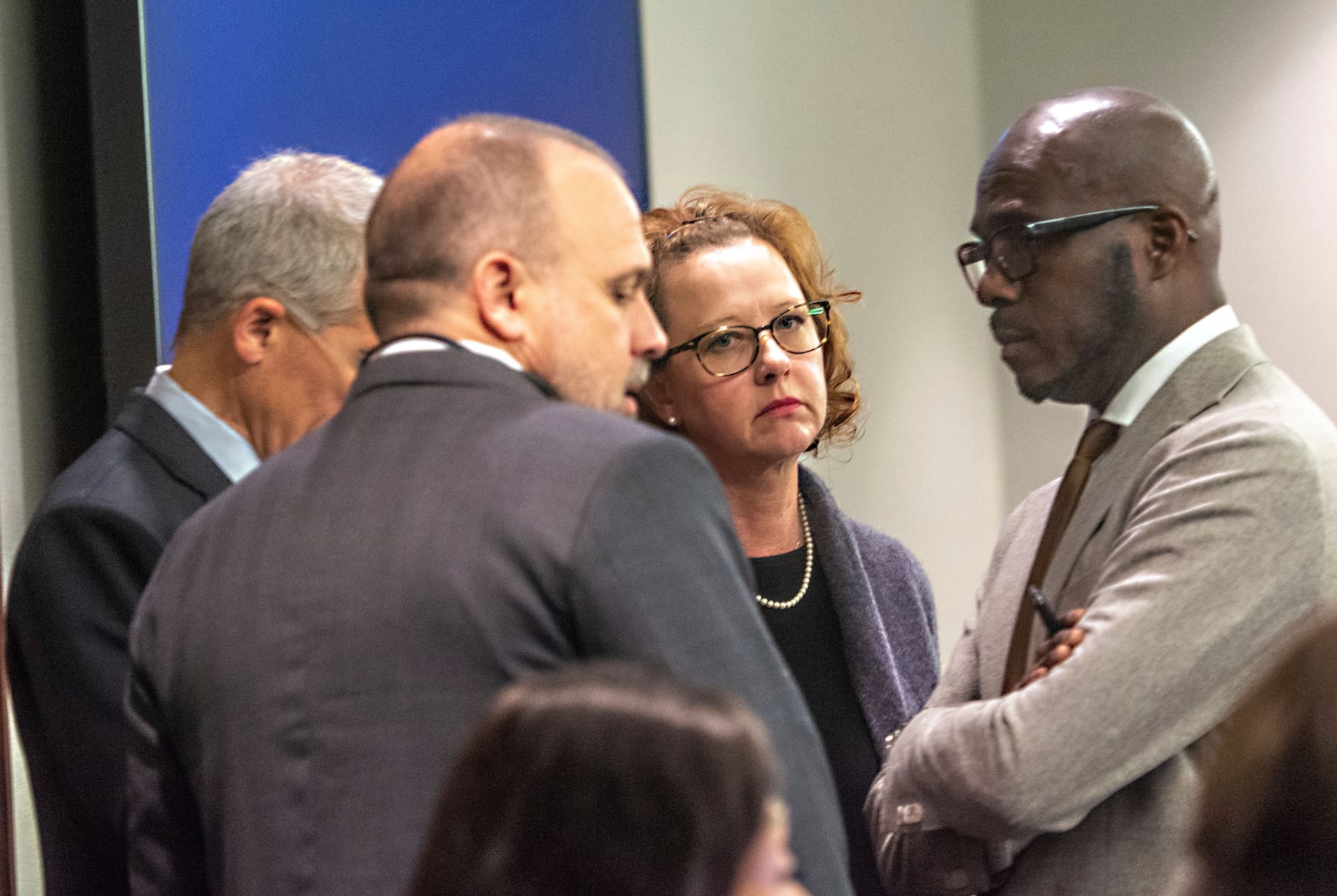 Former District Attorney Jackie Johnson, second from right, stands with her defense attorneys in court Tuesday, Jan. 21, 2025, in Brunswick, Georgia, as jury selection begins in her trial on misconduct charges. Johnson is charged with interfering with police investigating the 2020 killing of Ahmaud Arbery. (Michael Hall/The Brunswick News via AP, Pool)