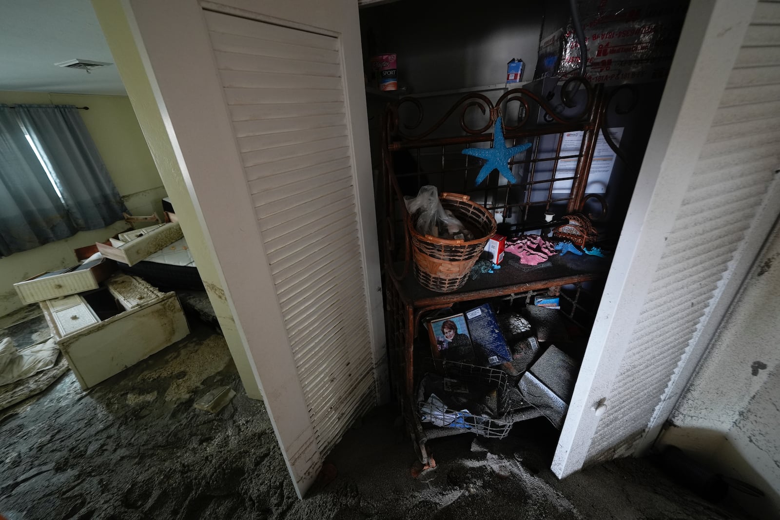 Several feet of displaced sand fills a condo following the passage of Hurricane Milton, at YCA Vacation Rentals in Venice, Fla., Friday, Oct. 11, 2024. (AP Photo/Rebecca Blackwell)