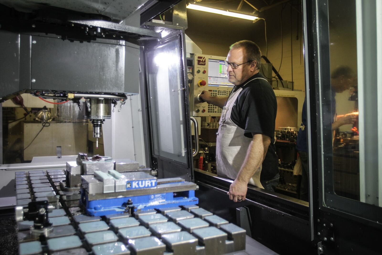 Bastech machinist, Bryan Winter Botham uses a probe to  tram the center of a part.