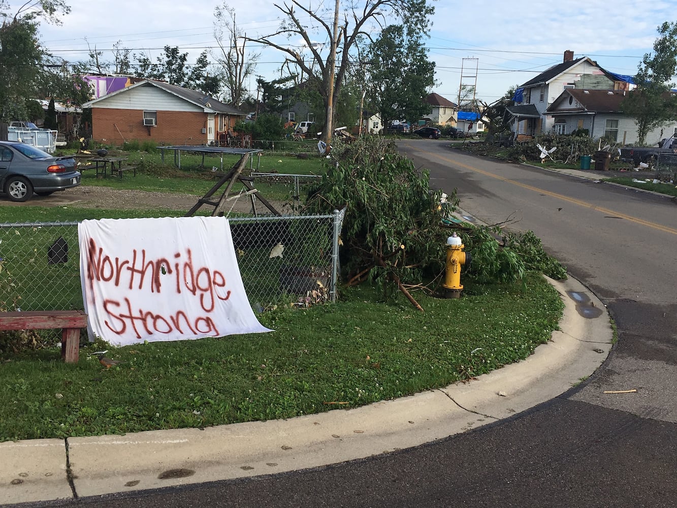 PHOTOS: Tornado-damaged communities dig out, clean up