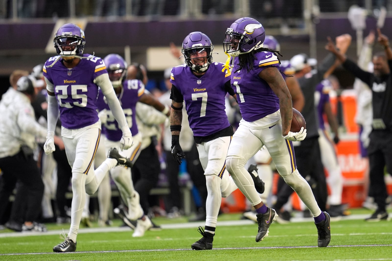 Minnesota Vikings cornerback Shaquill Griffin (1) celebrates after intercepting a pass during the second half of an NFL football game against the Arizona Cardinals Sunday, Dec. 1, 2024, in Minneapolis. (AP Photo/Abbie Parr)