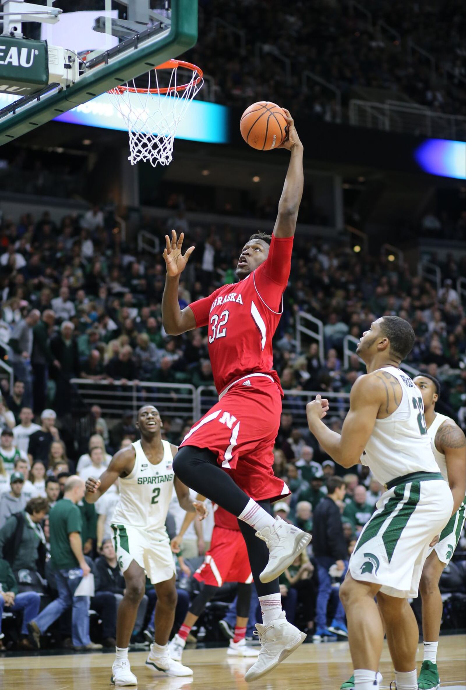 EAST LANSING, MI - DECEMBER 3: Jordy Tshimanga #32 of the Nebraska Cornhuskers goes up for a dunk during the game against the Michigan State Spartans at Breslin Center on December 3, 2017 in East Lansing, Michigan. (Photo by Rey Del Rio/Getty Images)