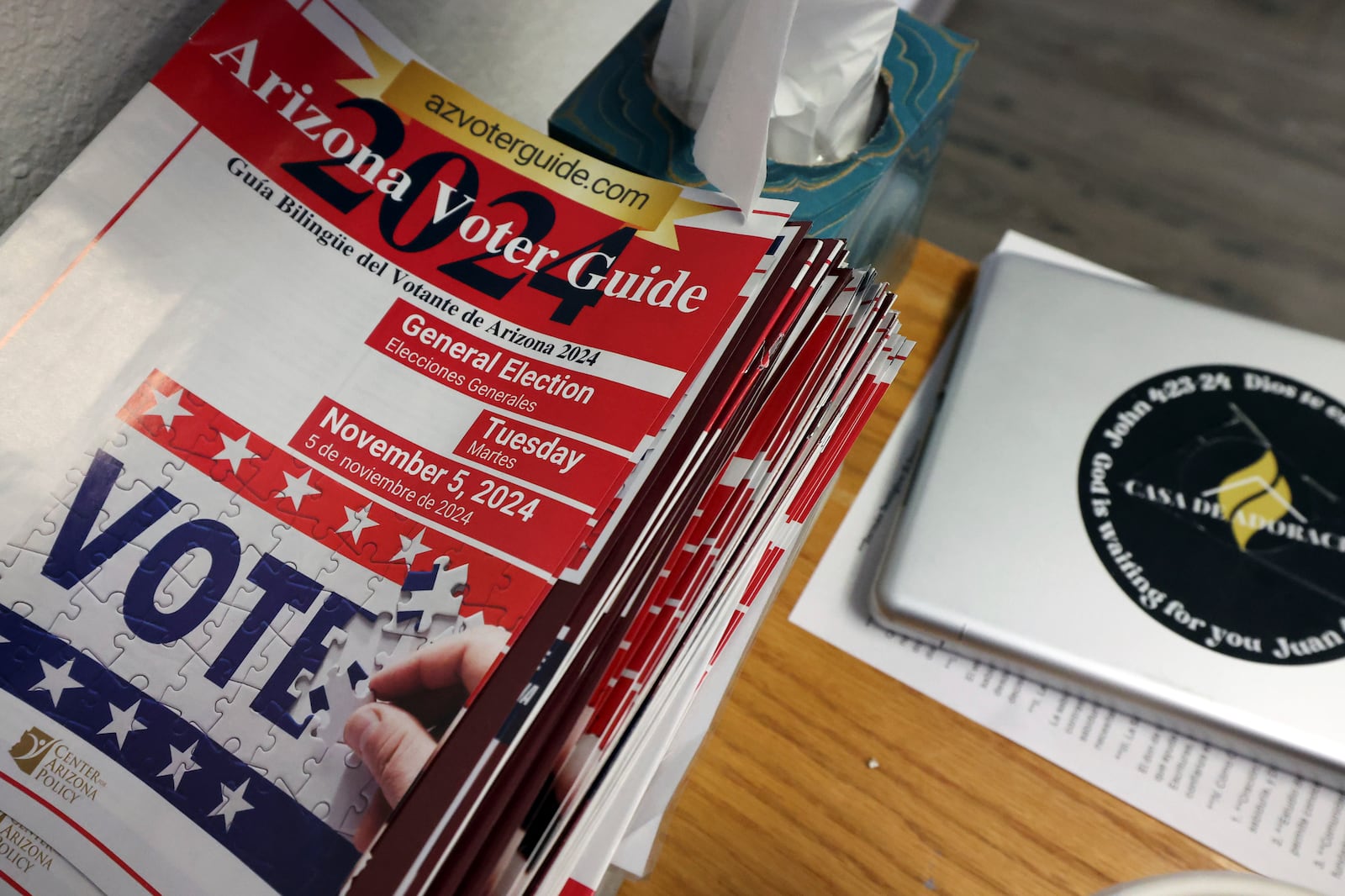 A 2024 Arizona Voter Guide is seen at Casa de Adoracion, Sunday, Oct. 27, 2024 in Phoenix. (AP Photo/Chris Coduto)