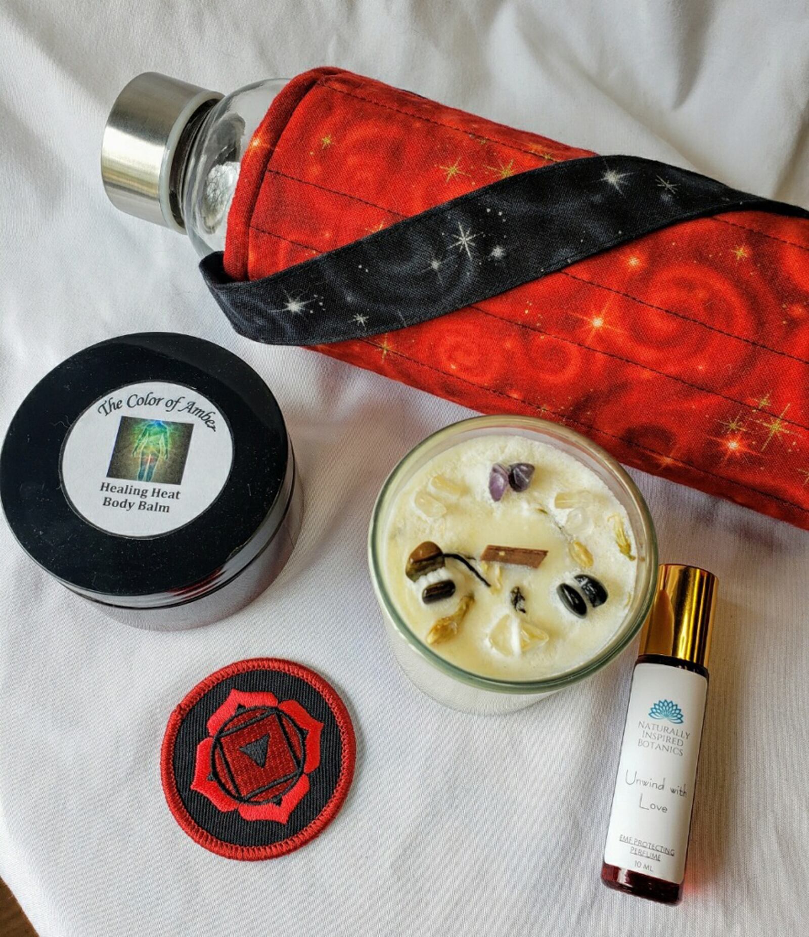 The âFeel The Heatâ bundle ($60) is made up of a bottle of Love oil blend and a soy candle from Naturally Inspired Botanics, a root chakra patch from Starseed and a red fabric bottle carrier and bottle made by JARAF. CONTRIBUTED PHOTO