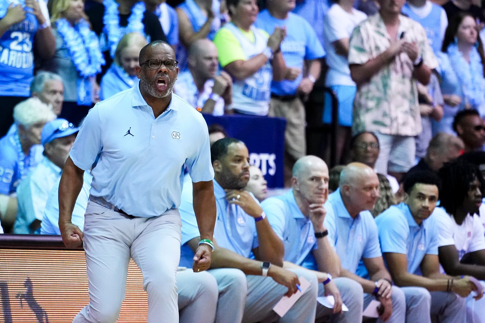 North Carolina head coach Hubert Davis yells from the sideline during the first half of an NCAA college basketball game against Auburn at the Maui Invitational Tuesday, Nov. 26, 2024, in Lahaina, Hawaii. (AP Photo/Lindsey Wasson)