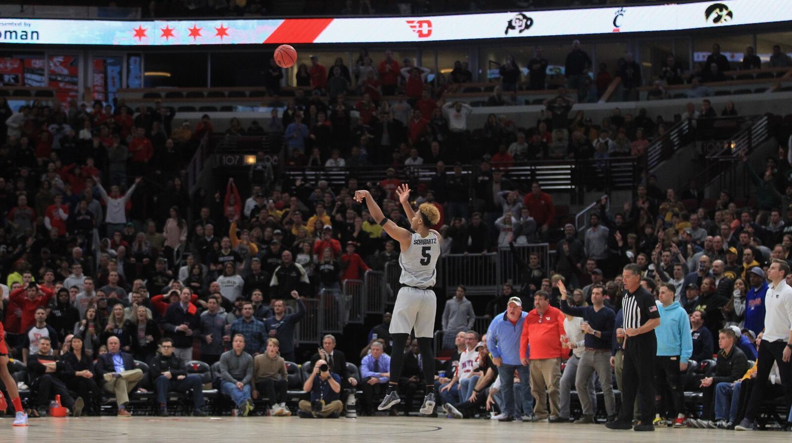 Colorado's D'Shawn Schwartz makes the game-winning 3-pointer against Dayton in overtime on Saturday, Dec. 21, 2019, at the United Center in Chicago. DAVID JABLONSKI/STAFF