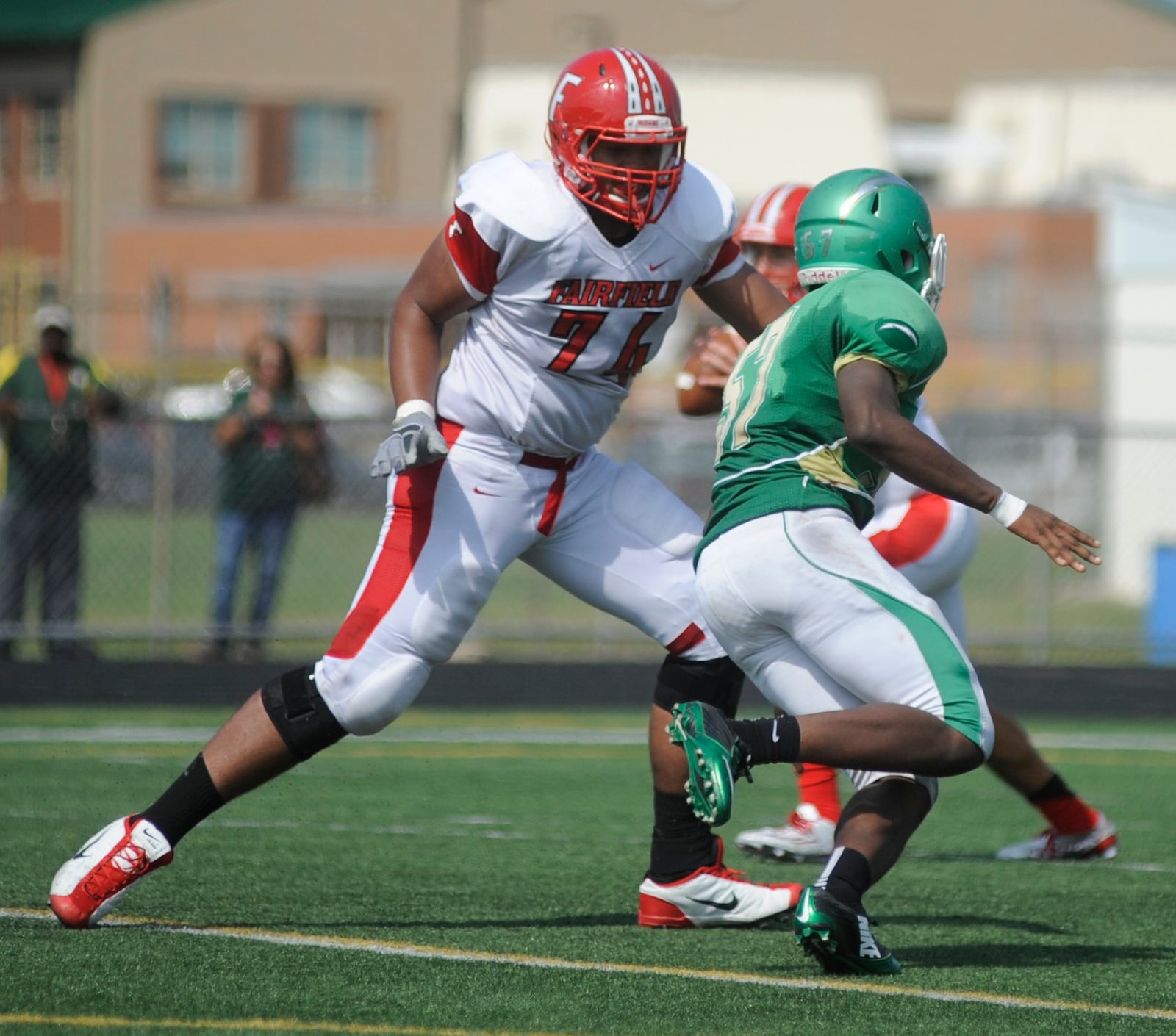 Fairfield offensive lineman Jackson Carman (left) takes out a Northmont defender. MARC PENDLETON/STAFF FILE