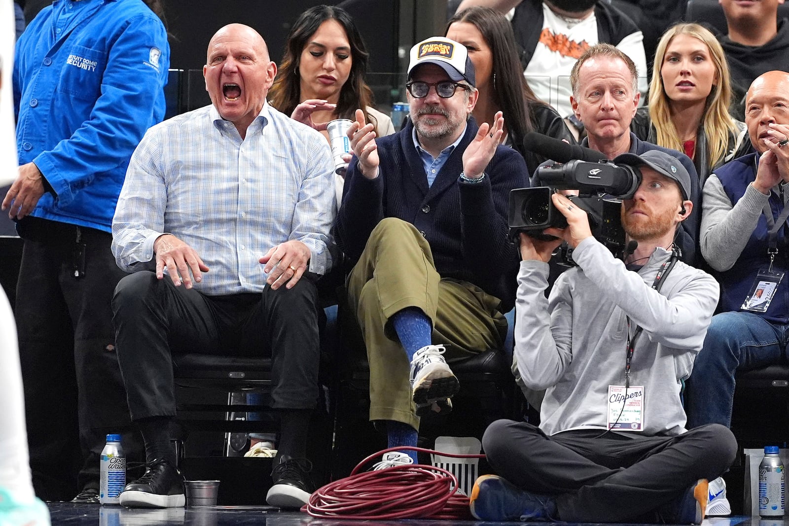 Los Angeles Clippers owner Steve Ballmer, left, and actor Jason Sudeikis celebrate after the Clippers scored during the second half of an NBA basketball game against the Memphis Grizzlies, Wednesday, Feb. 12, 2025, in Inglewood, Calif. (AP Photo/Mark J. Terrill)