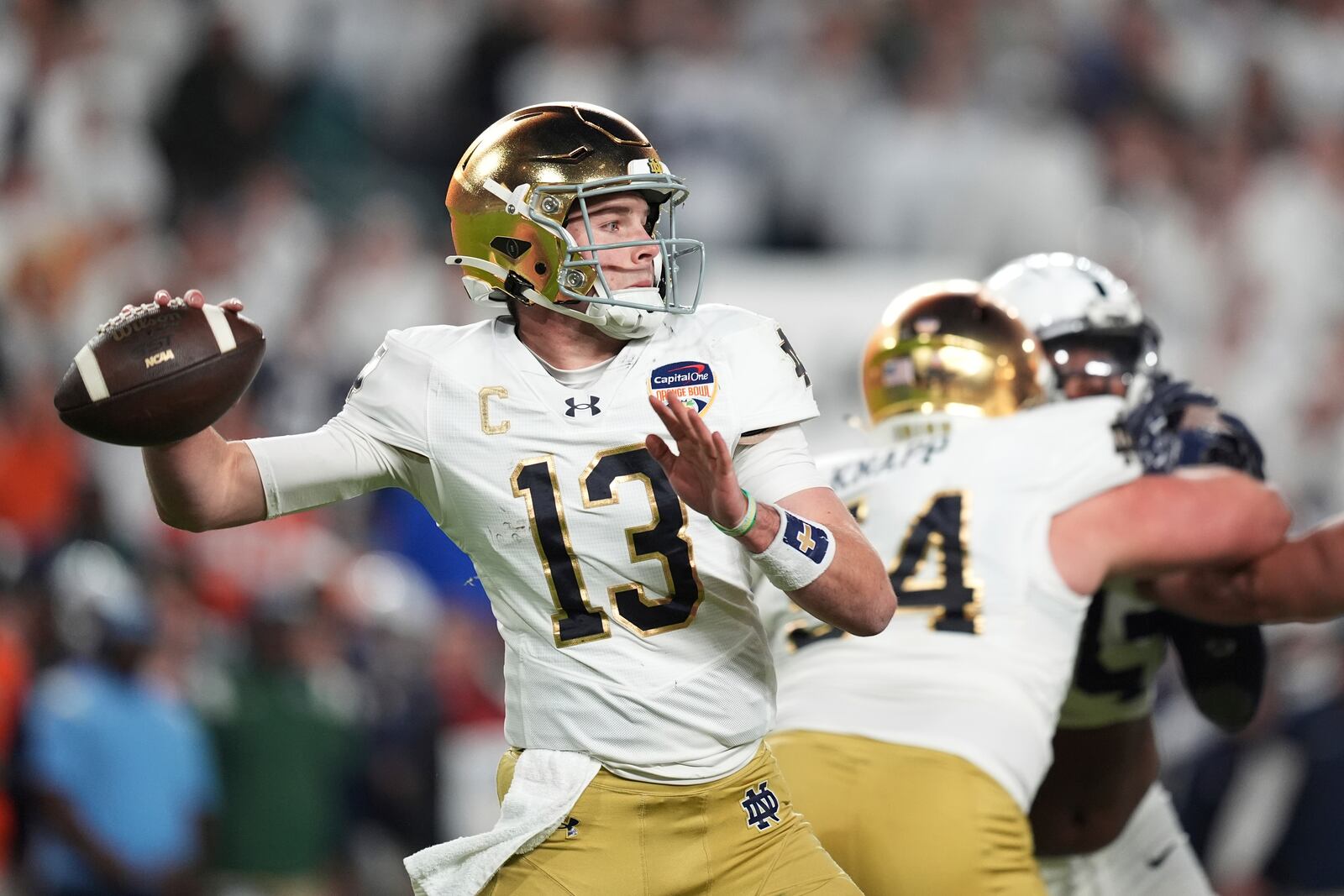 FILE - Notre Dame quarterback Riley Leonard (13) throws a pass during first half of the Orange Bowl College Football Playoff semifinal game against Penn State, Thursday, Jan. 9, 2025, in Miami Gardens, Fla. (AP Photo/Rebecca Blackwell, File_