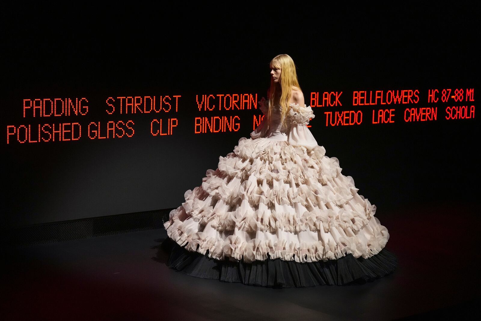 A model wears a creation as part of the Valentino Haute Couture Spring Summer 2025 collection, that was presented in Paris, Wednesday, Jan. 29, 2025. (AP Photo/Lewis Joly).