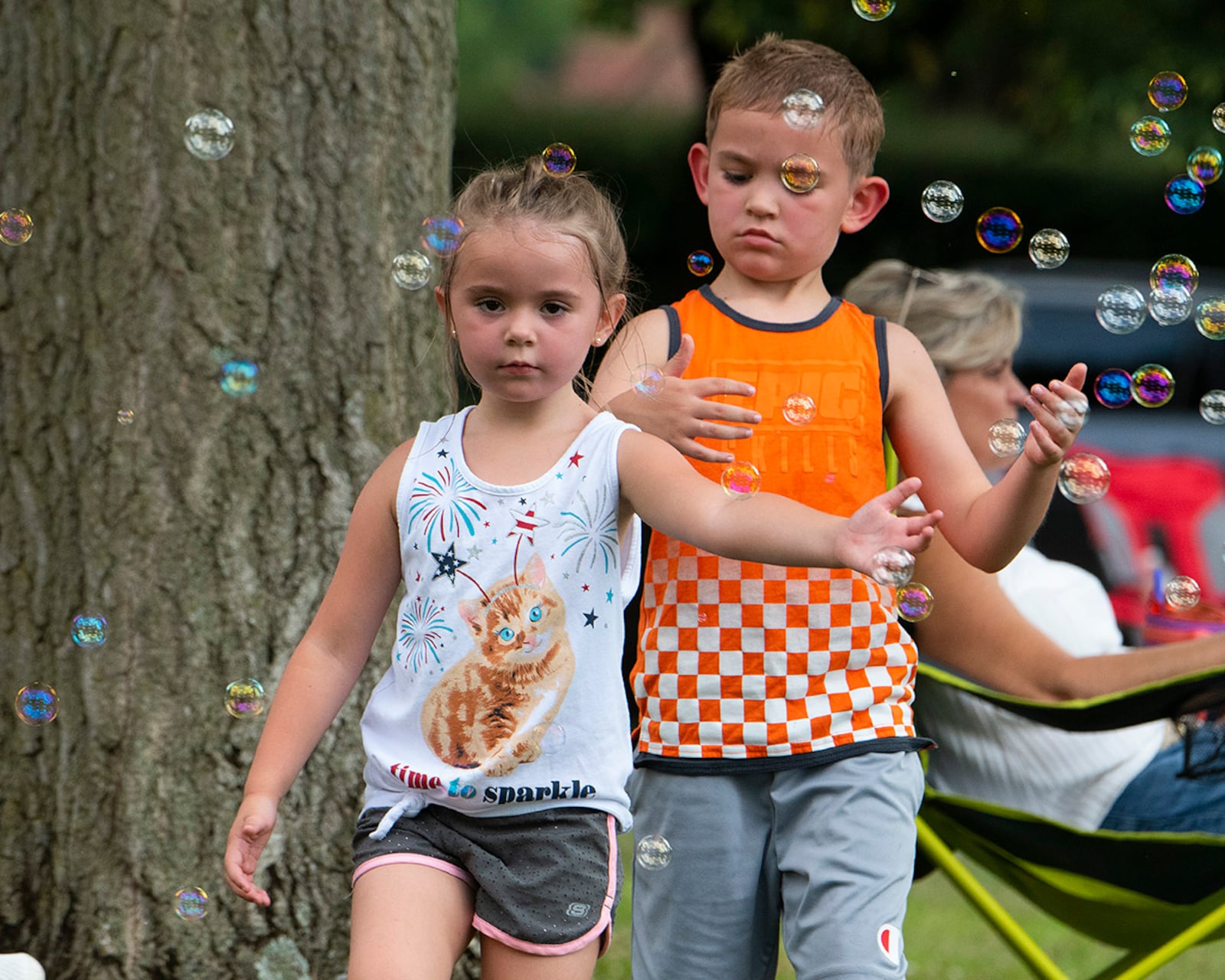 Lily, 5, and Skyler, 7, the children of 1st Lt. Brandon and Amber McVey, play among the bubbles at a block party Aug. 12. The party was the middle in a summer series of three sponsored by the 88th Force Support Squadron for Wright-Patt community members. U.S. AIR FORCE PHOTO/R.J. ORIEZ