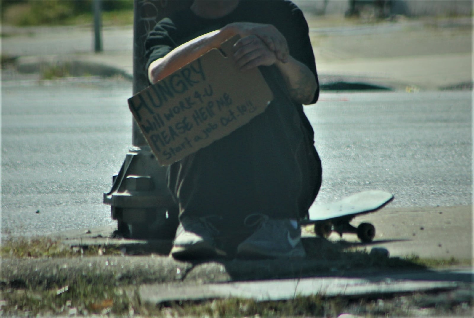 A homeless Dayton man holds up a sign Wednesday, Oct. 5, 2022 on Keowee Avenue looking for work opportunities. Cory Frolik/Staff Photo