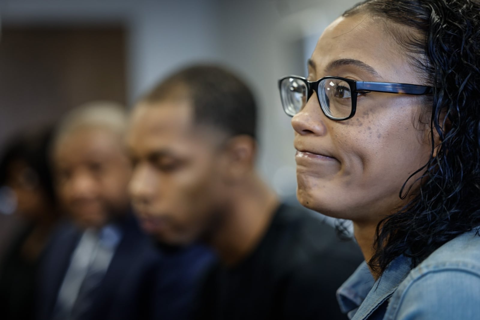 Taneshia Lindsay, right and Robert Tootle, center, react to questions from the media about their nonverbal, autistic son, Braylen, who was hit in the head by a former DPS employee, at attorney Michael Wright office in downtown Dayton Tuesday, July 23. The family is pursuing a lawsuit against the school system and former employee. JIM NOELKER/STAFF